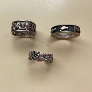 Three sterling silver rings.